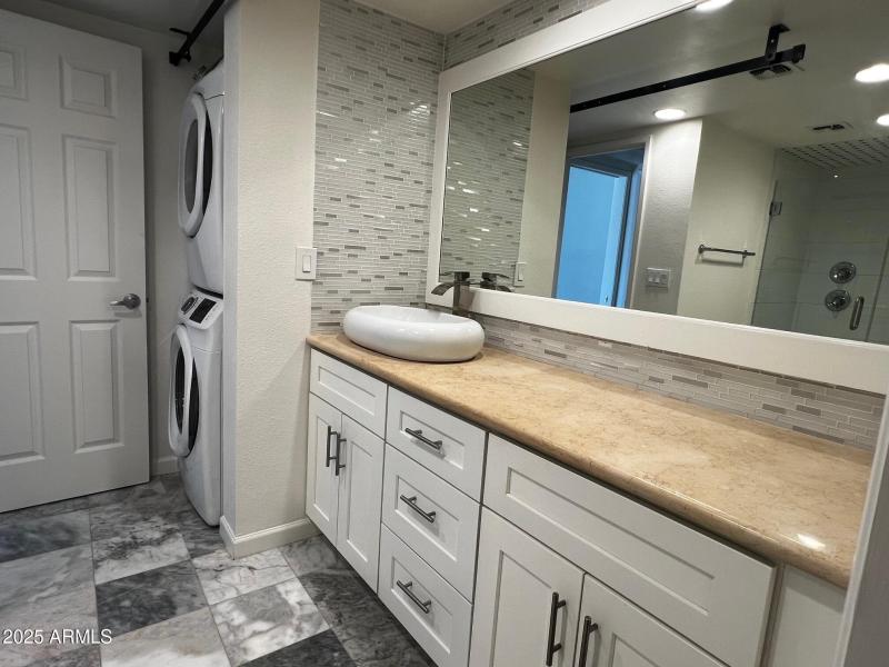 Vanity and stacked laundry