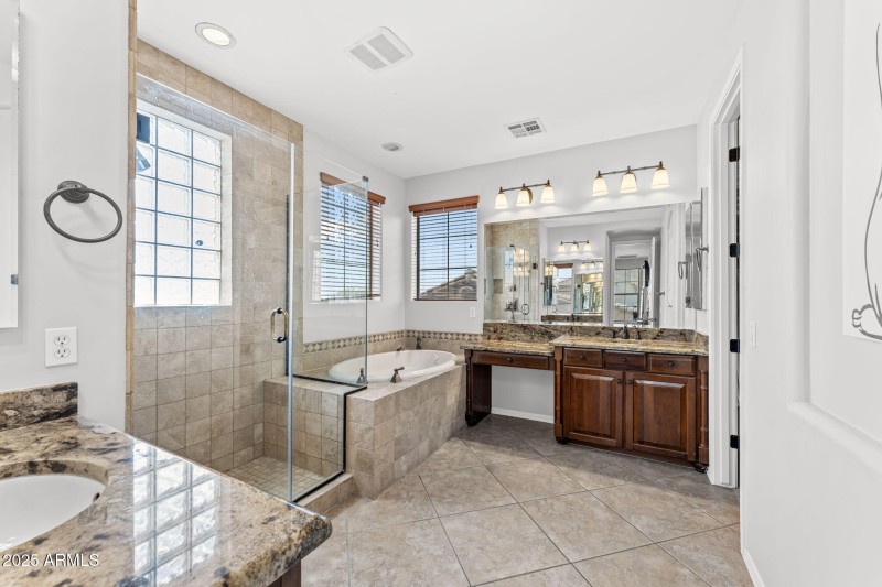 Separate shower / tub with stone accents