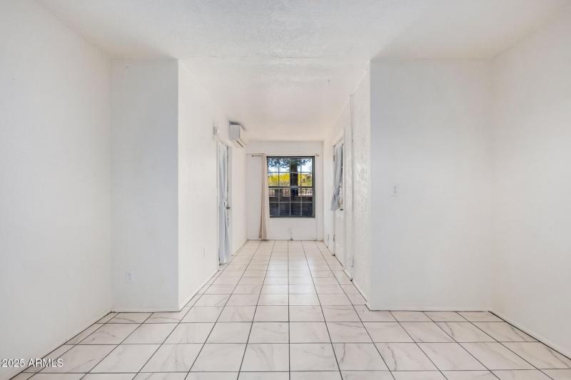 Bright Walkway With Backyard View