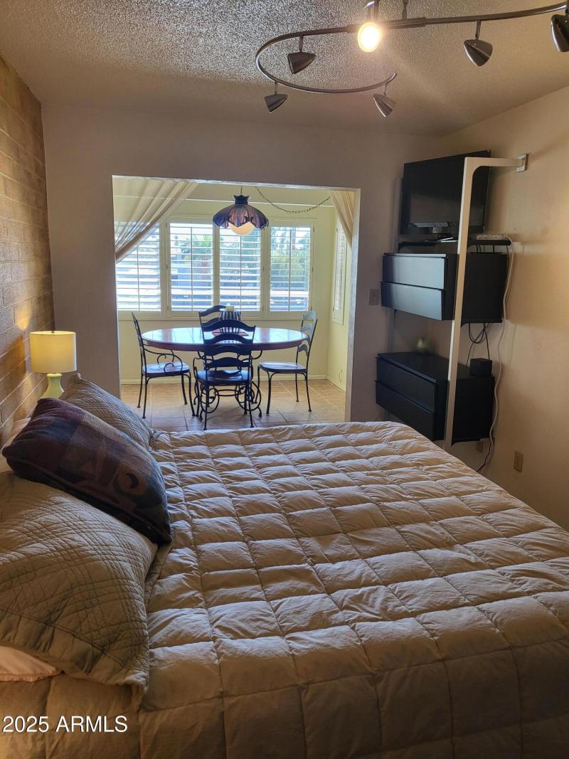 EXIT TO ENCLOSED BALCONY