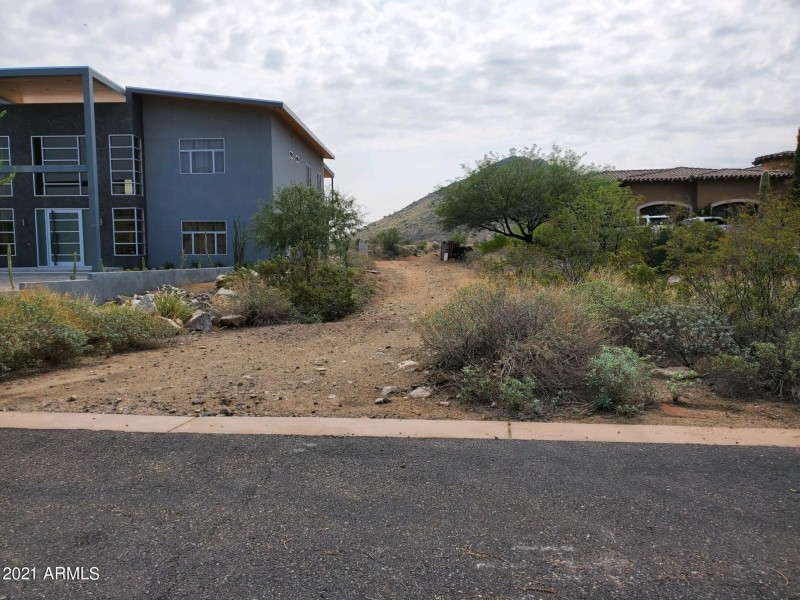 Private driveway entrance to main lot.