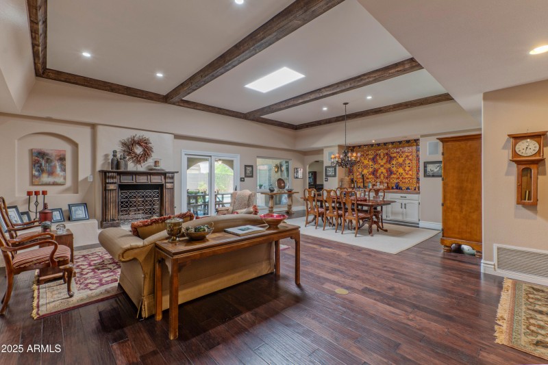 Living/dining overlooks patio/pool