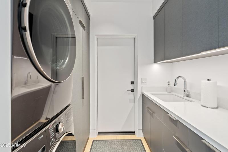 Laundry w/ Custom Tile & Cabinetry