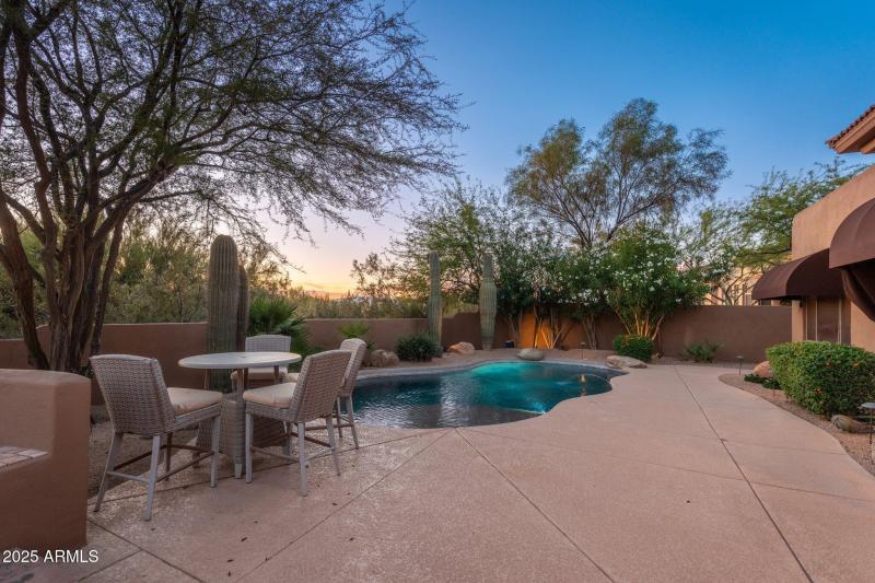 Backyard Pool View At Twilight