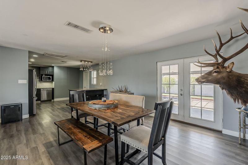 DINING AREA W/FRENCH DOORS TO PATIO