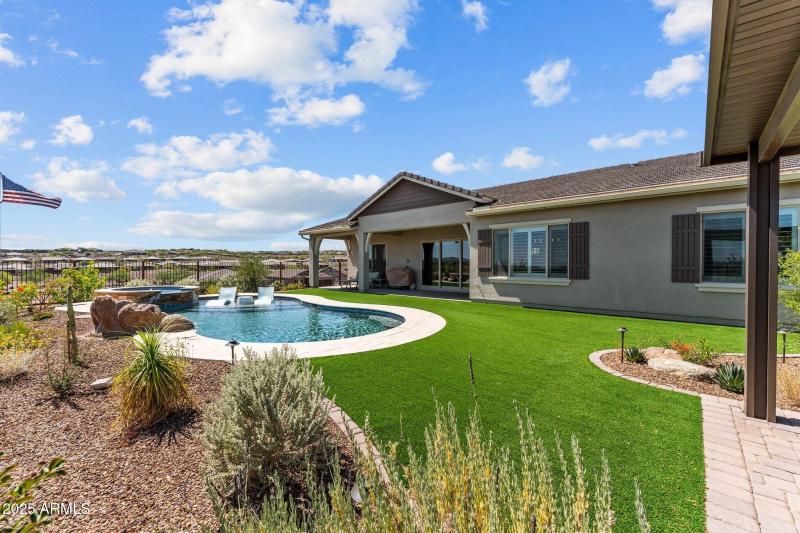 Large yard with pool and spa