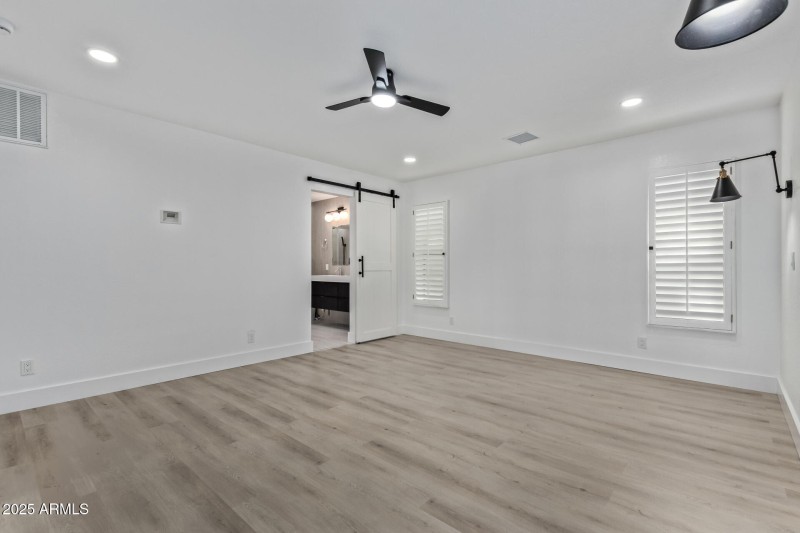 Barn door to bathroom in master