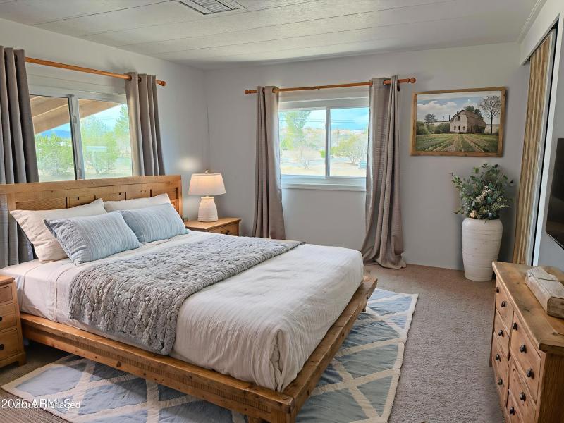 12 Virtually staged primary bedroom Stan