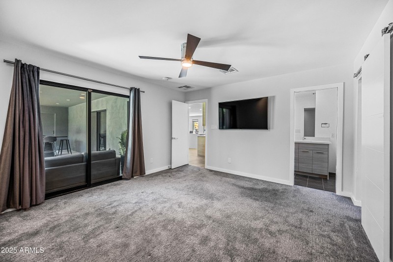 Primary Suite - Sliders Open to Patio