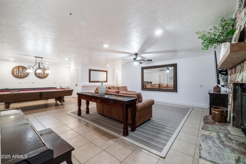 basement great room with fireplace