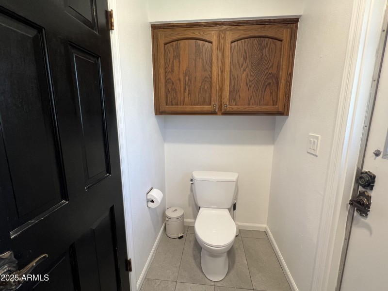 Primary Bathroom Toilet and Cabinets
