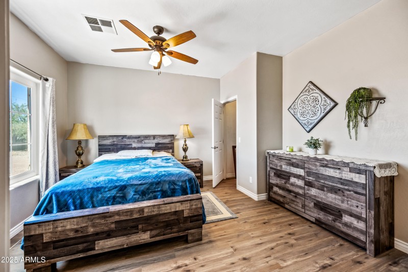 Primary bedroom walk in closet
