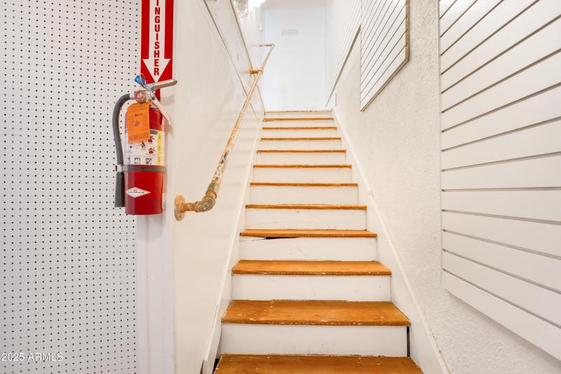 Stairs from showroom to basement