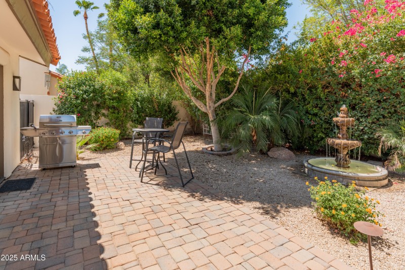 Fountain in back welcomes humming birds!