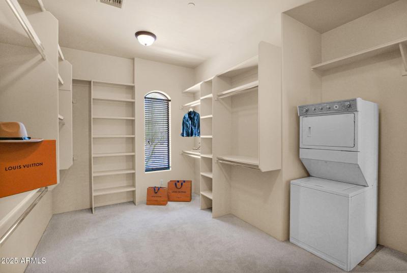 secondary laundry in primary closet