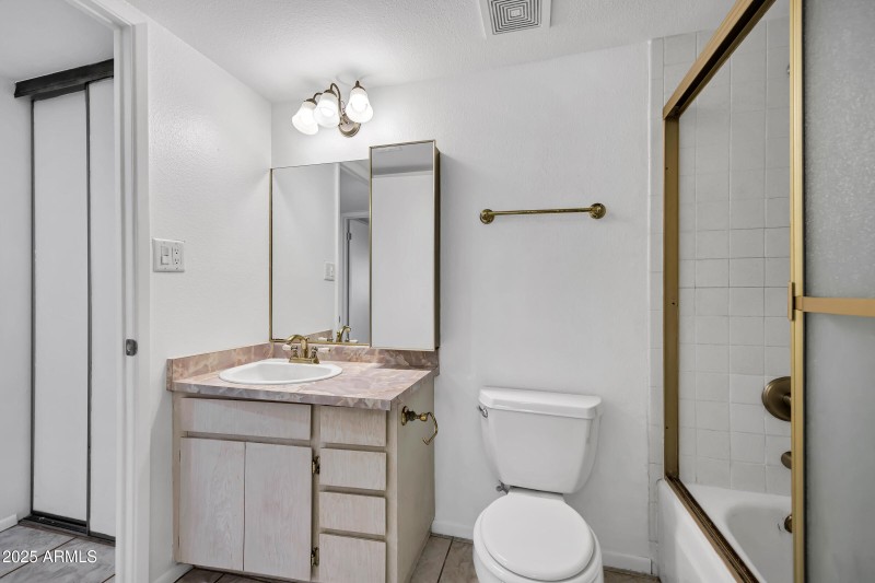 Bathroom with gold accents