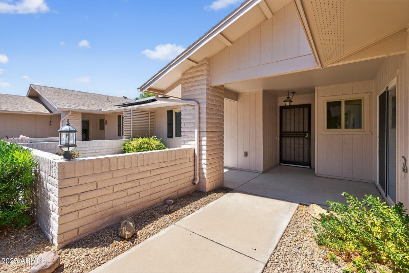 Covered front entry & sunny patio