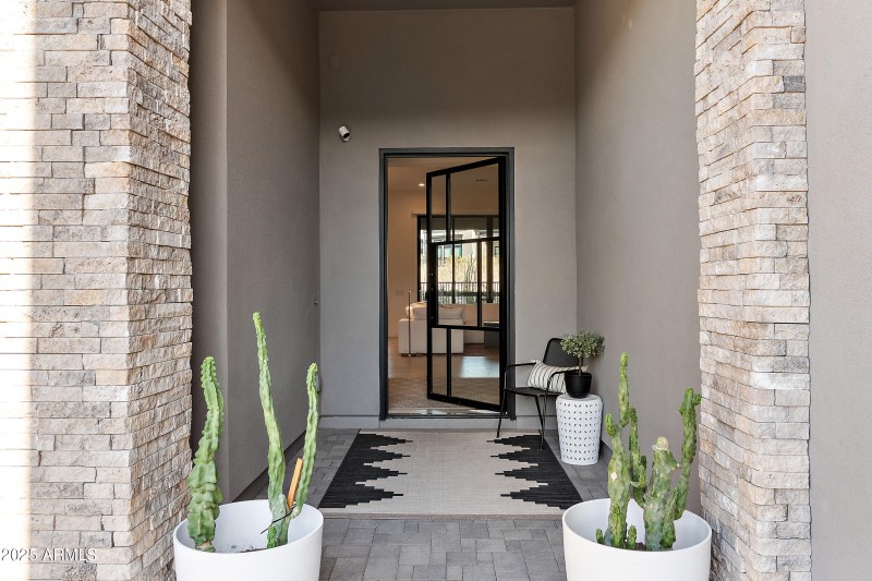 Entrance w/ glass & steel front door