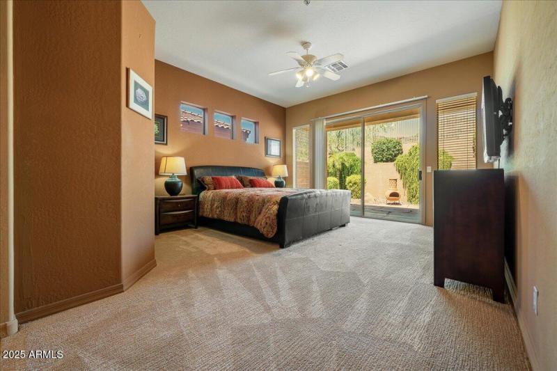 Primary Bedroom Has Door to Backyard