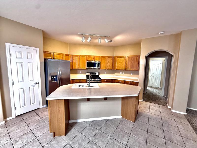 Open Kitchen w/Island & SS Appliances