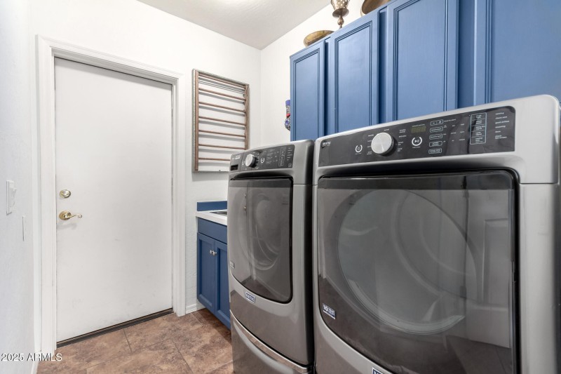 Laundry Room with cabinets & sink