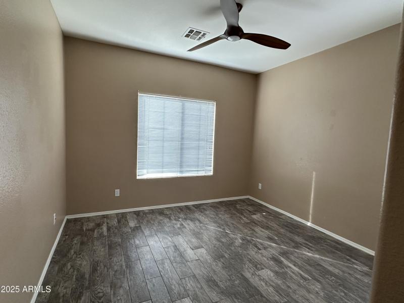 Bedroom 2 with fan and blinds