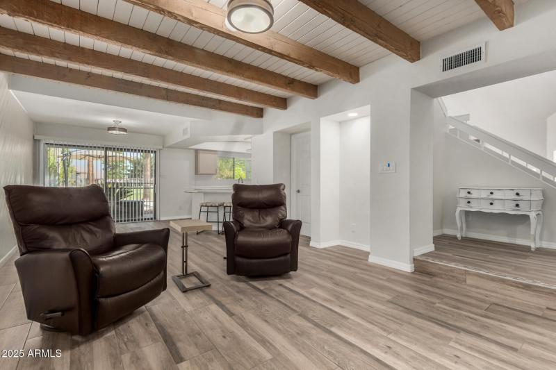 Cozy Family Room With Beamed Ceilings