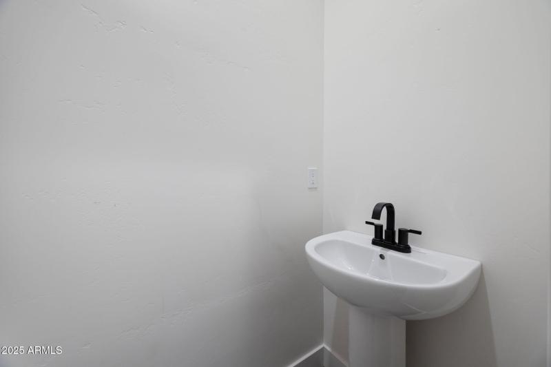 Half bath by garage and laundry room
