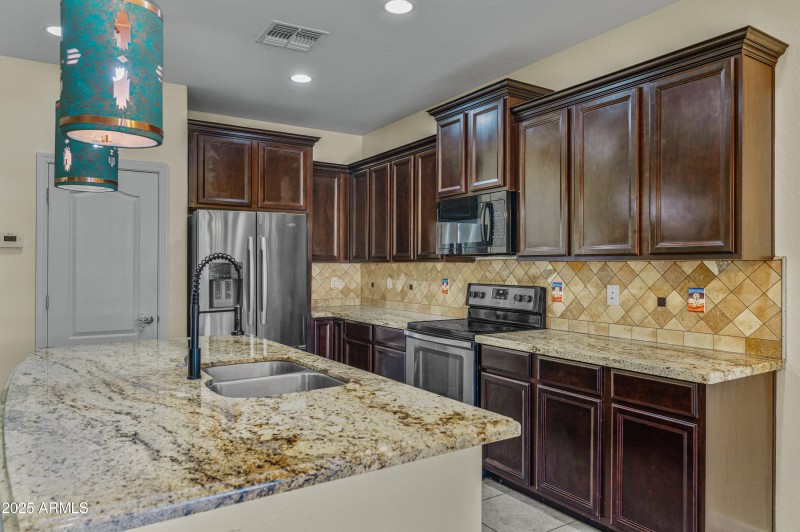 Gorgeous hanging lights over island