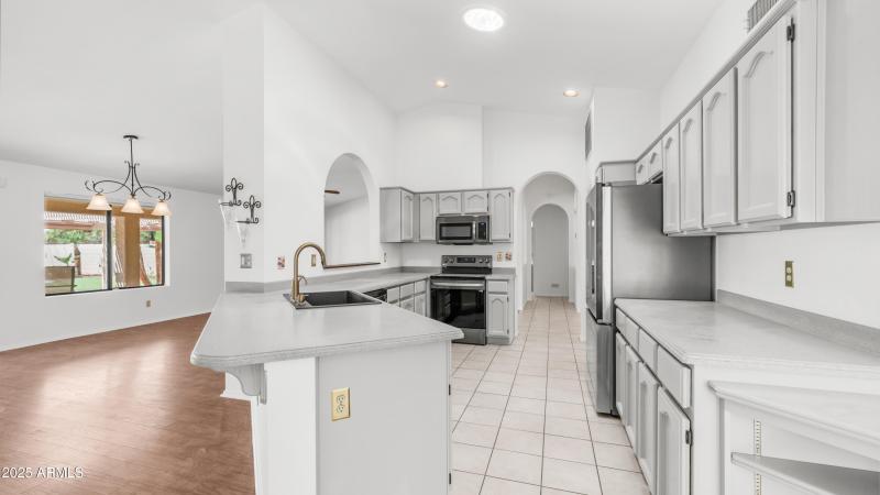 Kitchen looks into family room