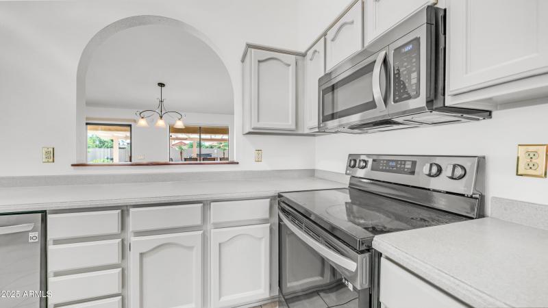 Kitchen has stianless appliances