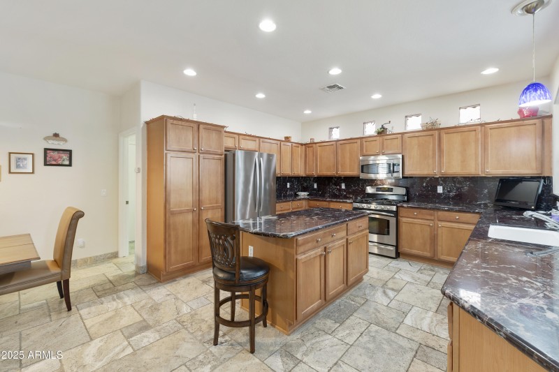 Kitchen with eating area and island
