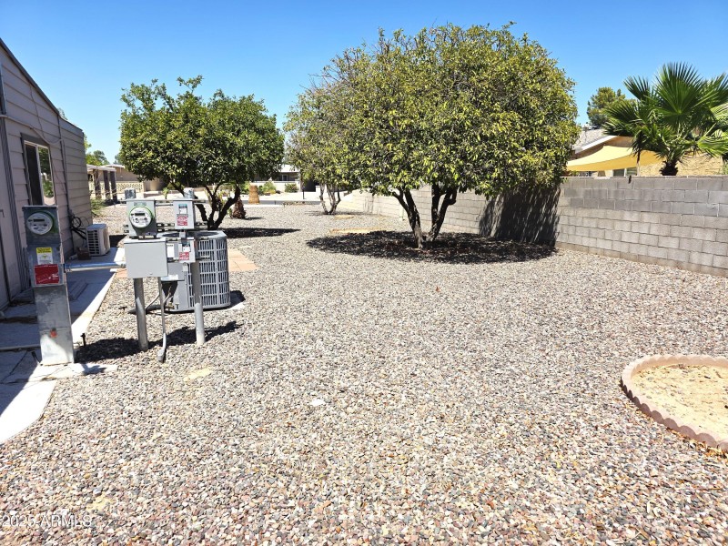 Rear Yard showing new ac unit and Solar