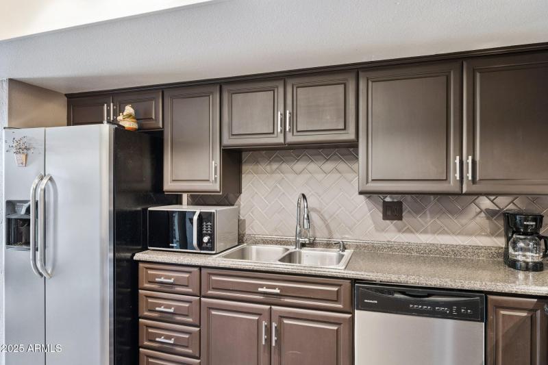 Notice the Custom Herringbone Backsplash