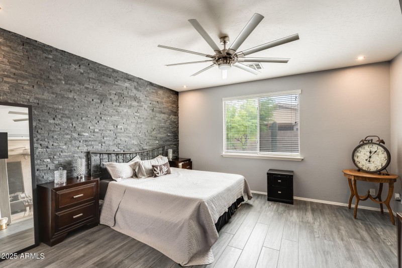 Primary bedroom with slider to backyard