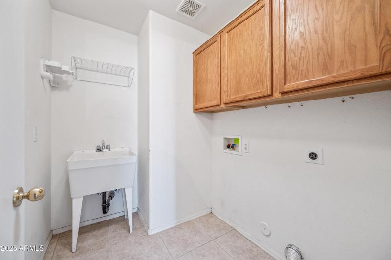 Large Laundry Room with Sink and Storage
