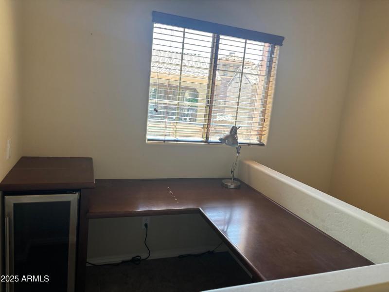Built-in office nook with wine fridge.