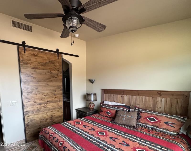 Apartment bedroom barn door to bath