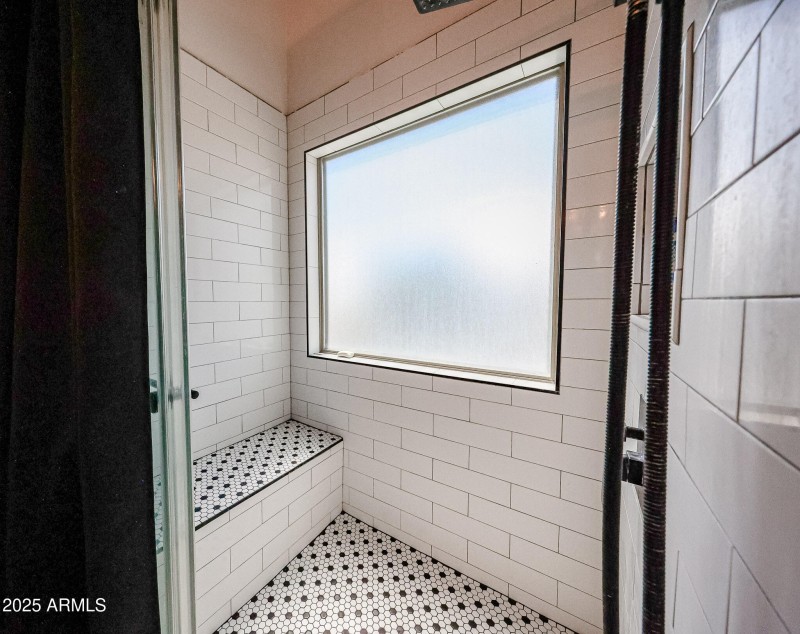 Primary walk-in shower w/bench