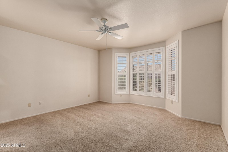 Primary bedroom with bay window