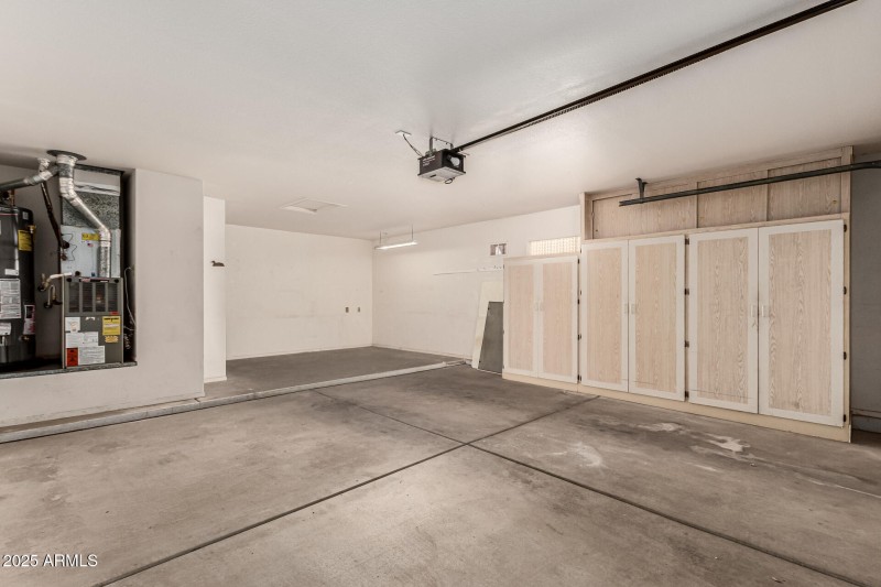 Cabinets and bonus space in the garage