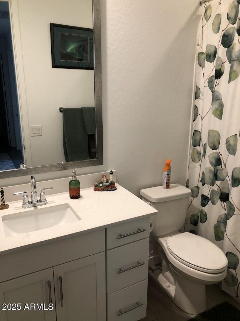 guest bathroom with shower tub combo