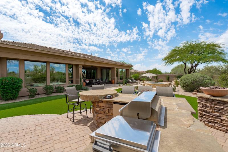 74-BBQ and Fireplace Area to Pool