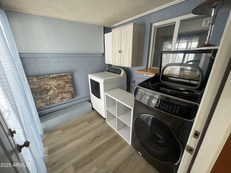 Laundry room w/ top of line washer