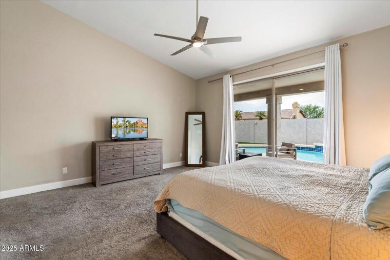 Primary Bedroom with Sliders out to Pool
