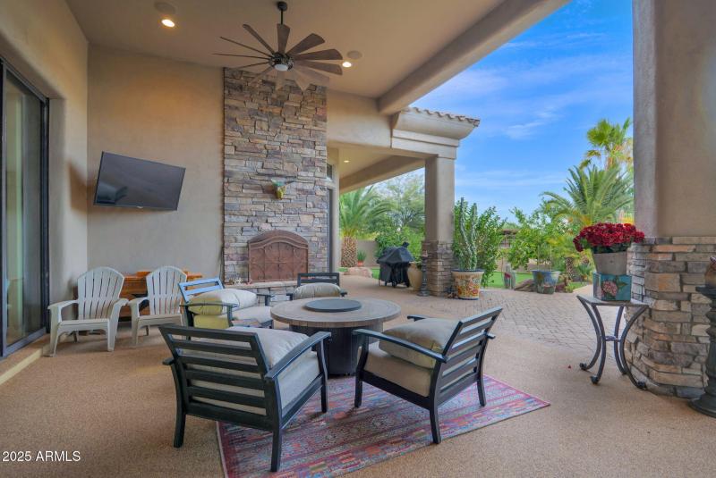 Outdoor back dining with fireplace
