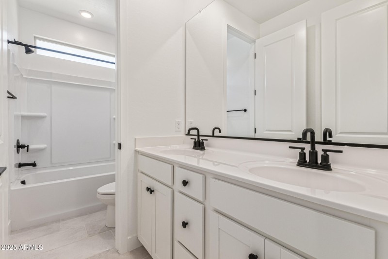 Full Bathroom with Dual Sinks and 2 Do