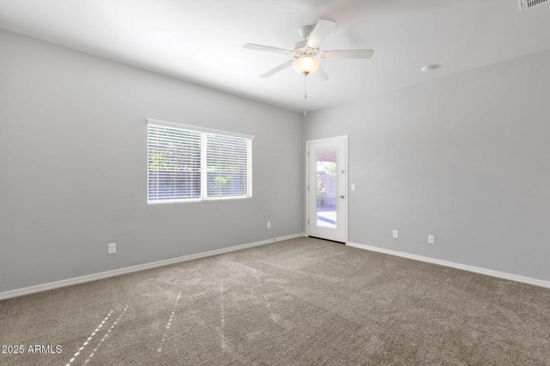 Primary Suite w/ access to backyard