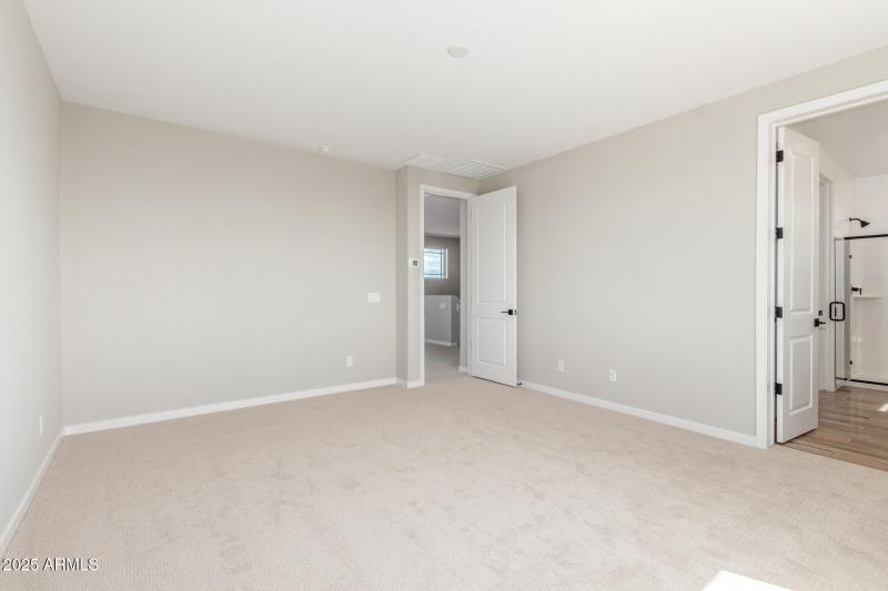 Primary Bedroom with Door to Bathroom