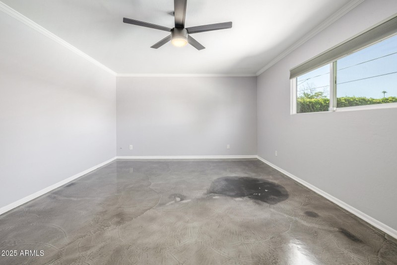 Primary Bedroom with view of backyard